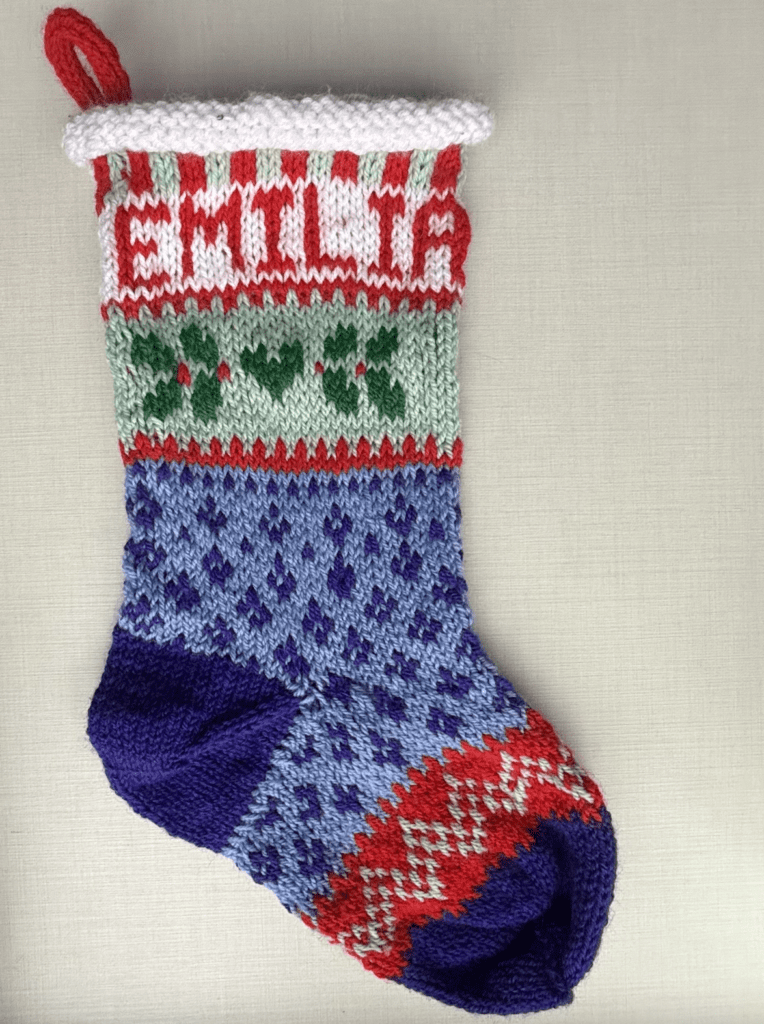 christmas stocking handknit with multiple colors and fair isle knitting