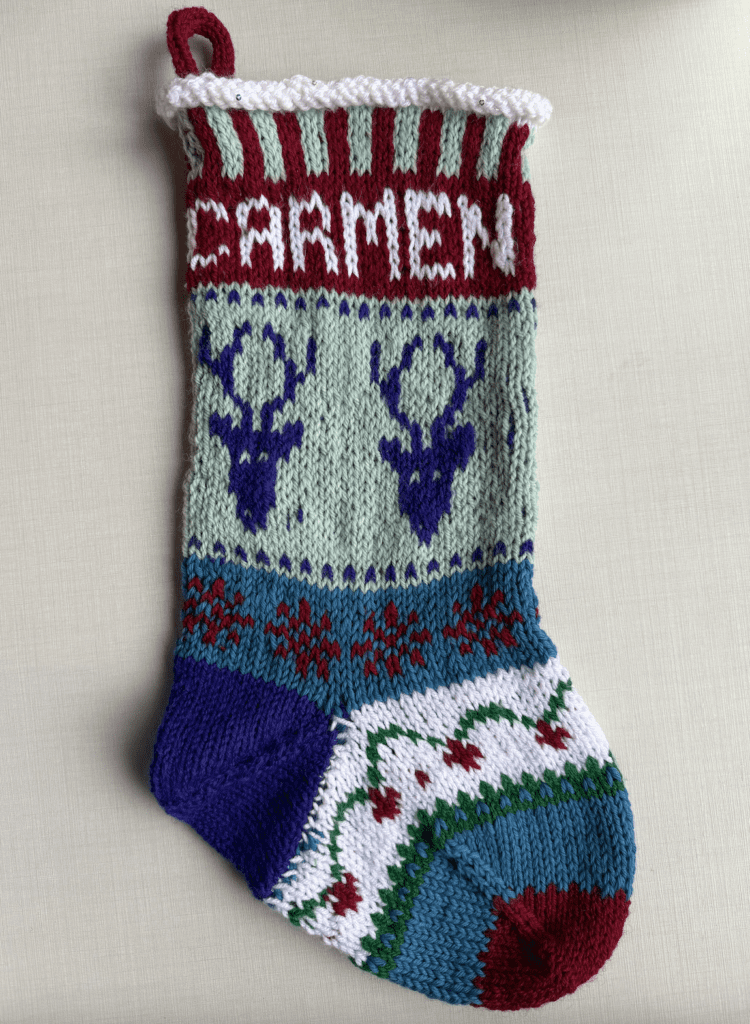 handknit christmas stocking with reindeer