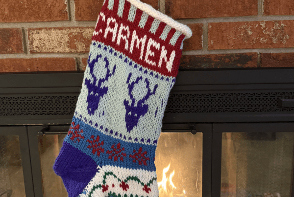 handknit stocking for Carmen with reindeer