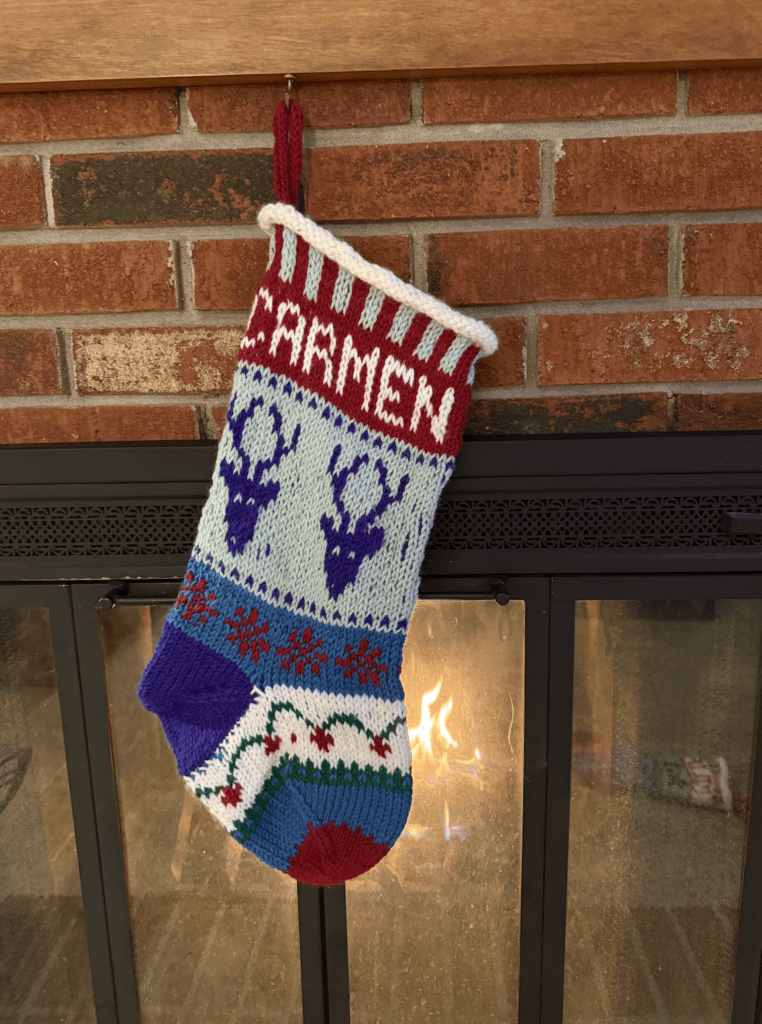 handknit stocking for Carmen with reindeer